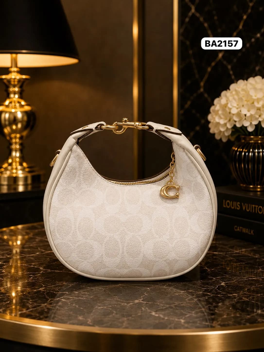 Cream monogram crescent bag